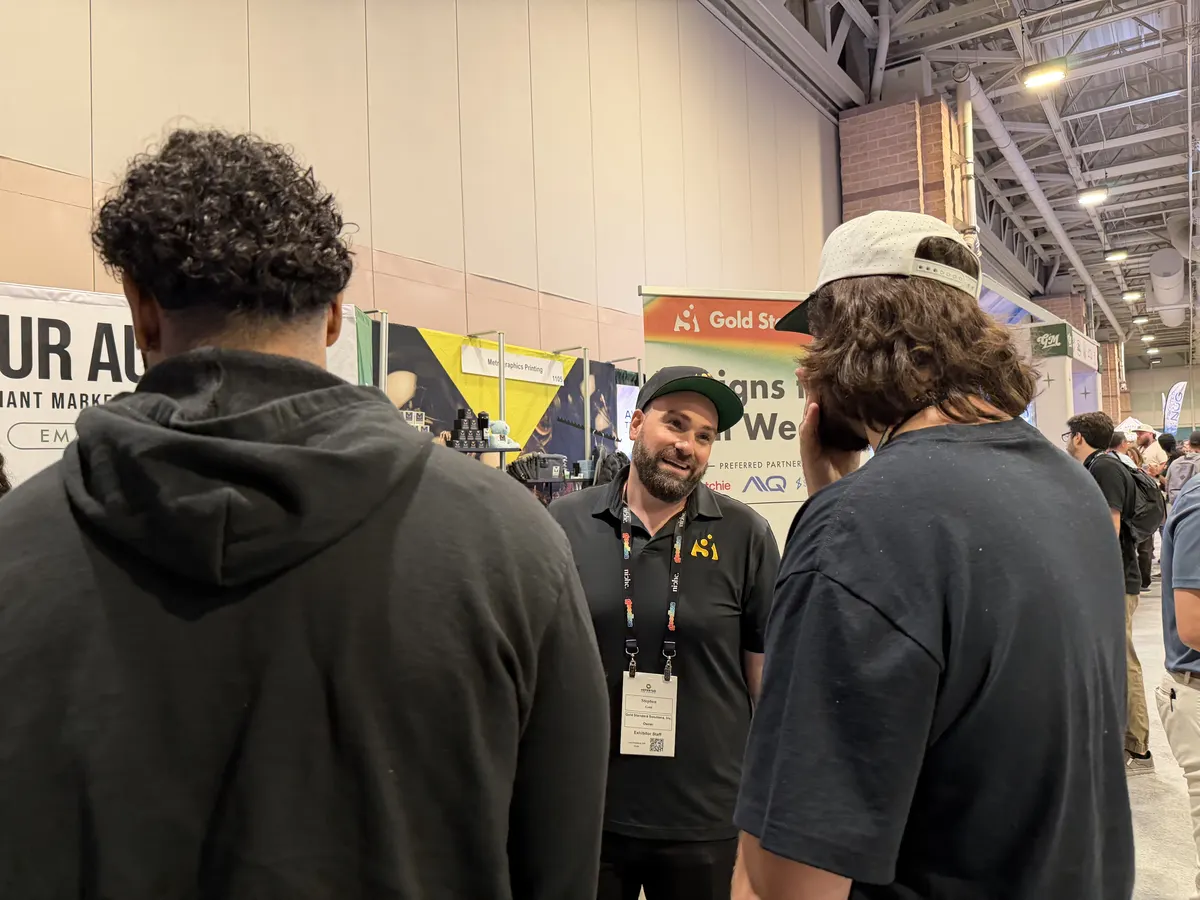 Stephen Gold speaking with attendees at cannabis expo booth