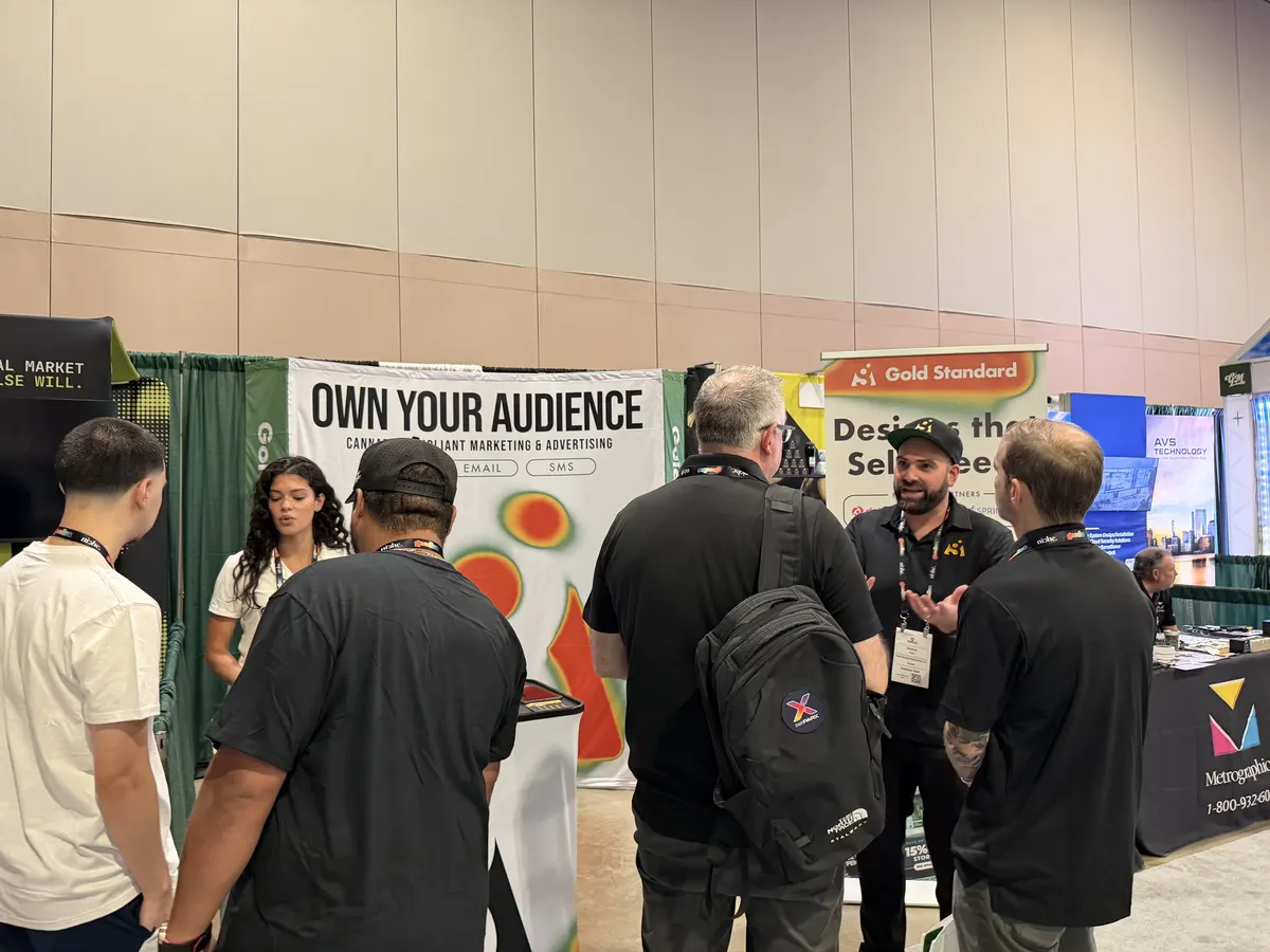 Gold Standard Solutions team engaging with visitors at cannabis industry expo booth